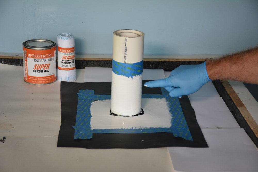 Apply first coat of Super Silicone Seal over pipe and roof area